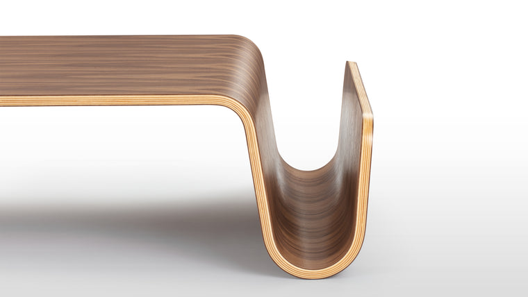 Sleek Sophistication | Featuring a gently curved, asymmetrical silhouette, the Scando Coffee Table adds a touch of modern sophistication to any room. The use of premium molded plywood with a rich, natural finish infuses warmth and character into its design.
