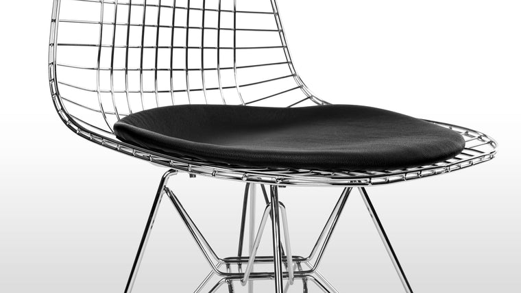 Comfort meets Craftsmanship | Precision-welded steel makes up the ergonomic wire frame of this chair. Paired with a classic leather seat, for everyday comfort, the Eiffel Wire Chair is beloved for its fusion of engineering acumen and style.  
