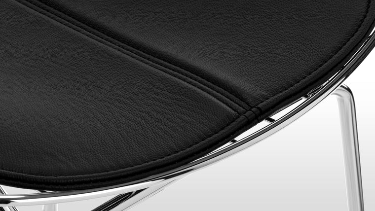 BUILT TO LAST | Expertly crafted with a high-spec chromed steel frame and comfy leather seat pad, this chair is a modern classic made with longevity in mind.
