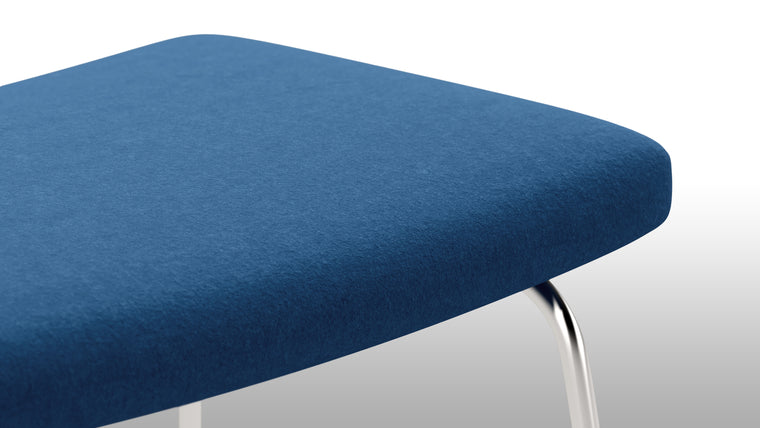 Stylish Stool|The ottoman's versatile design extends beyond being a footrest. It can also double as an extra seat or a convenient surface for holding books, trays, or decorative items. Its sturdy base ensures stability, making it a functional and practical addition to any living space.
