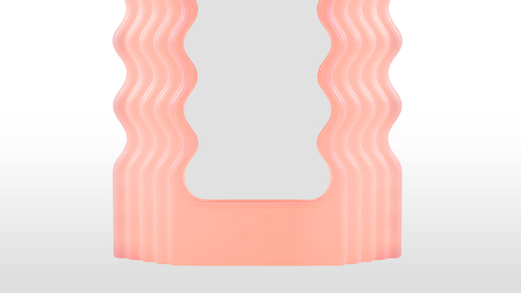 GLOW UP | With its striking look and signature waves, the Ettore Sotsass mirror has the power to transform interiors with a sense of joie de vivre. A mesmerizing fusion of modernist, futuristic, and contemporary design, the stand-out nature of this piece allows it to find a place in any design scheme looking for some personality.
