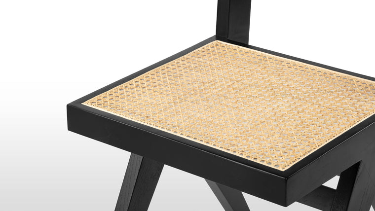 STYLISH SPECIFICS | Proving that beauty is in the details, the Pierre Jeanneret Dining Chair boasts a rattan seat and back that are meticulously handmade by talented artisans.
