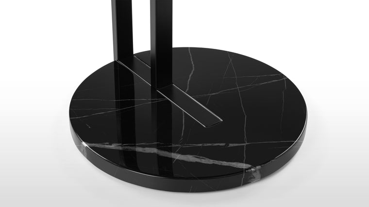 Polished to Perfection | The black marble base provides a luxurious foundation not only ensures stability but also introduces a touch of opulence. The rich texture of the marble adds depth and visual interest, making the Rondo Side Table a captivating addition to any room.
