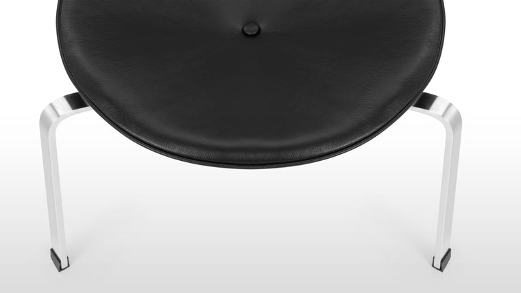 Minimalist Excellence | The stool's simple, tripod-like base creates a visually striking design while maintaining stability. This minimalist approach ensures that the Poul Stool is a true work of functional art, seamlessly blending into any setting.
