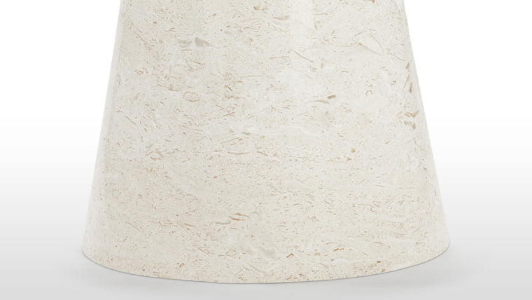 Sophisticated Stone | At the heart of this dining table is the lustrous limestone tabletop, a work of art crafted by nature itself. Its smooth, round surface showcases the unique veining and texture of the limestone, creating a captivating focal point that adds depth and character to any dining area.
