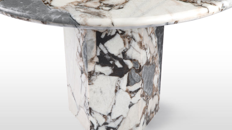 Old Meets New | A contemporary take on the pedestal base table, the Saga dining table features a hexagonal plinth base, meaning lots of room underneath to squeeze in extra diners and a clean, linear silhouette.

