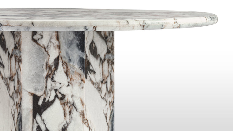 Marble Masterpiece | Made from honed natural Italian modellato marble, this beautiful modern table makes a stunning centrepiece. Its simple, striking form pays homage to this luxurious material, accentuating the distinctive texture and patina.
