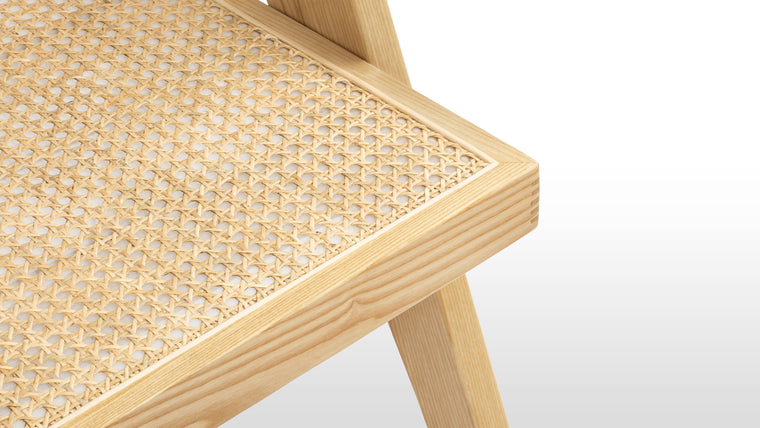 TIMELESS DESIGN | A durable wooden frame, complete with angled legs and tapered armrests, provides the ideal combination for this chair’s comfortable seat and supportive back.
