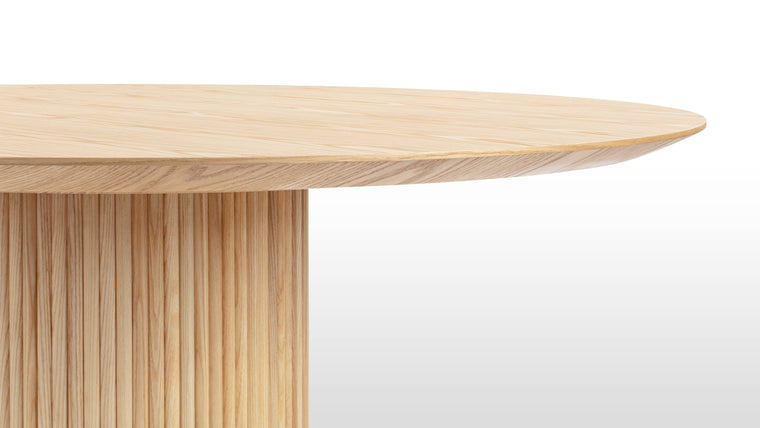 OLD MEETS NEW | A modern take on the pedestal base table, the Decelle dining table features a column-like central leg, meaning lots of room underneath to squeeze in extra diners and a clean, linear silhouette.
