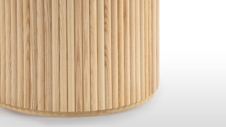QUALITY CRAFTSMANSHIP | Made from ash hardwood in a coated natural finish, this beautiful contemporary table features a circular top, refined by its bevelled edge, and heavy pedestal base which is visually softened by ash reeding.
