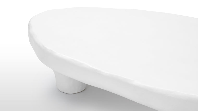Concrete Chic | Molded in high-quality concrete, the Kobe Coffee Table exudes strength and durability while maintaining an organic feel. The material's inherent versatility allows for the creation of intricate details and textures that enhance the table's overall visual appeal.
