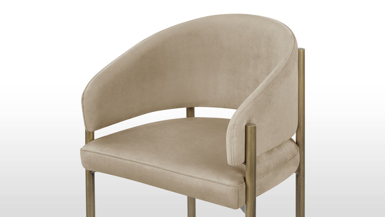 Refined Luxury | Upholstered in sumptuous upholstery, it offers a luxurious tactile experience while ensuring durability and easy maintenance. The indulgent texture of the fabric adds an extra layer of opulence, inviting you to indulge in comfort as you dine in style.
