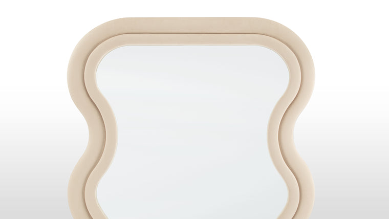 Opulent Edge | With its luxurious upholstery seamlessly enveloping the sturdy frame, the Isla Floor Mirror embodies a tactile allure that beckons to be touched. The soft, premium fabric not only adds an inviting dimension but also offers a delightful contrast to the mirror's clean, contemporary lines.
