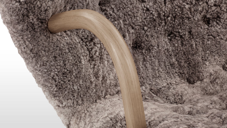 NORDIC DETAILS | Playfully named because of its resemblance to a shell, the Clam chair’s simple, playful form pays homage to Scandinavian design in its honest, understated use of European hardwood and plush upholstery.
