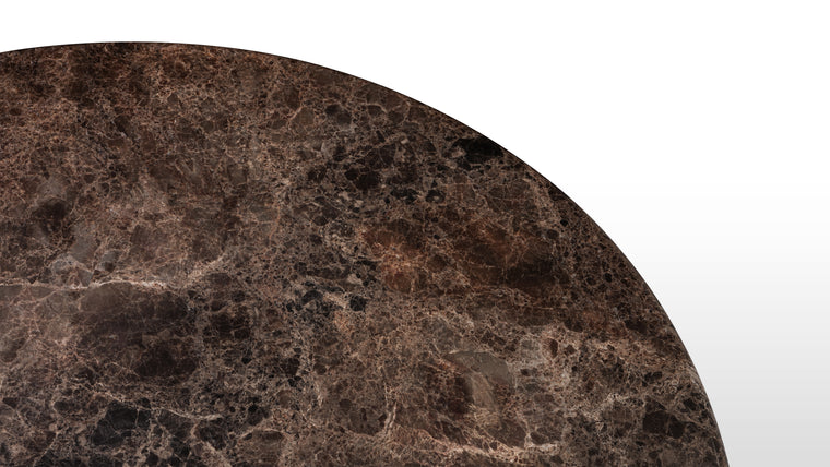 MARBLE MASTERPIECE | Made from honed natural Dark Emperador marble, this beautiful modern table makes a stunning centrepiece. Its simple, striking form pays homage to this luxurious material, accentuating the distinctive texture and patina.
