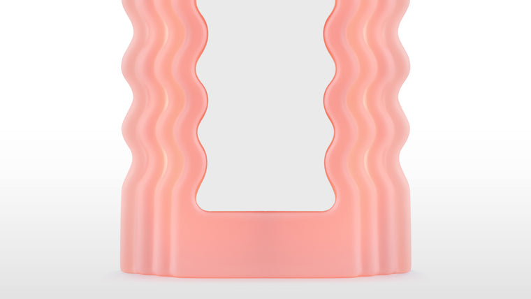 GLOW UP | With its striking look and signature waves, the Ettore Sotsass mirror has the power to transform interiors with a sense of joie de vivre. A mesmerizing fusion of modernist, futuristic, and contemporary design, the stand-out nature of this piece allows it to find a place in any design scheme looking for some personality.
