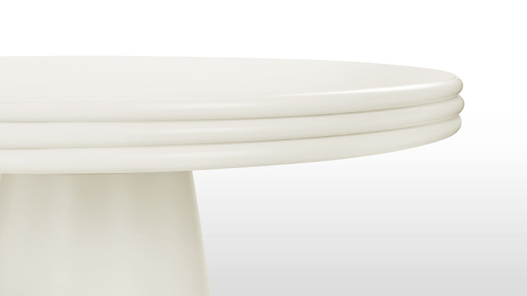 Graceful Details | At first glance, the dining table's round silhouette exudes a sense of harmony and balance, inviting you to explore its intricate details. The tabletop, a masterpiece in itself, boasts a distinctive stacked design that adds depth and visual interest.
