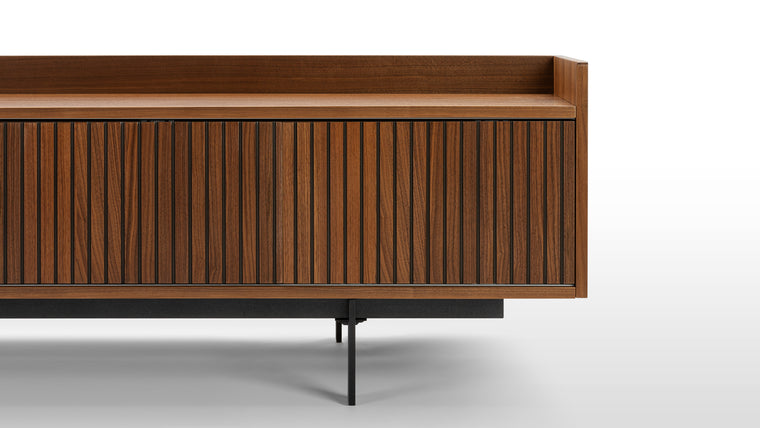Sleek Functionality | The console’s doors slide via a track, providing access to the internal space whilst also creating alternative styling opportunities. Slim, neat legs lifts up the body, adding a lightweight feel.
