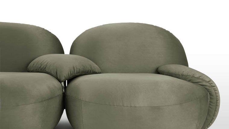 SOFT AND CURVACEOUS | Constructed with a sturdy frame and upholstered in premium materials, the Pacha Sofa exudes quality craftsmanship and enduring beauty. Its graceful curves and opulent upholstery make it a stunning focal point in any room, while its ergonomic design ensures optimal support and comfort.
