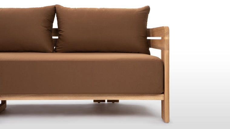 Beautifully Resilient | Enhanced with high-performance outdoor fabric cushions, the Lusso Outdoor Sofa ensures luxurious comfort without compromising on durability.
