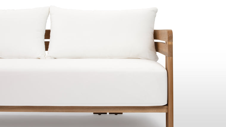 Beautifully Resilient | Enhanced with high-performance outdoor fabric cushions, the Lusso Outdoor Sofa ensures luxurious comfort without compromising on durability.
