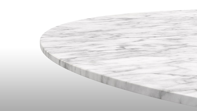 MARVELOUS MARBLE | This stylish iteration of the Aarhus Dining Table is handcrafted from only the finest materials, including a stunning white marble tabletop that’s just as beautiful as it is functional.
