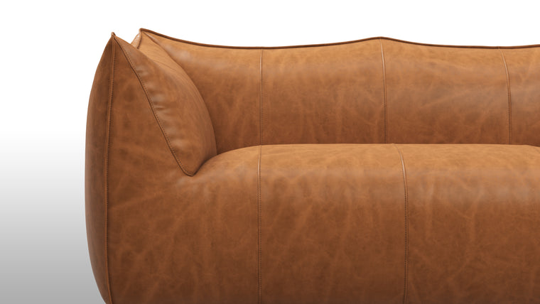 Cozy Comfort | Comfort is not compromised in the Bambole Sofa. Sink into its plush cushions and feel a sense of relaxation wash over you. The ergonomic design cradles your body, offering a cozy and supportive seating experience. Whether you're curling up with a book or enjoying a moment of solitude, this sofa envelops you in a world of comfort and tranquility.
