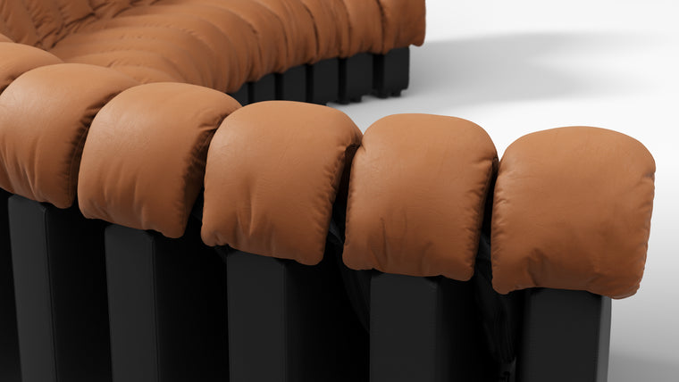Sculptural Seating | Crafted with uncompromising attention to detail, the DS 600 Sofa showcases exceptional craftsmanship and luxurious materials. The plush upholstery, available in an array of fabrics from premium vegan leather to boucle, envelops you in unparalleled comfort. The elegant stitching and meticulous finishes reflect a dedication to quality and design integrity.
