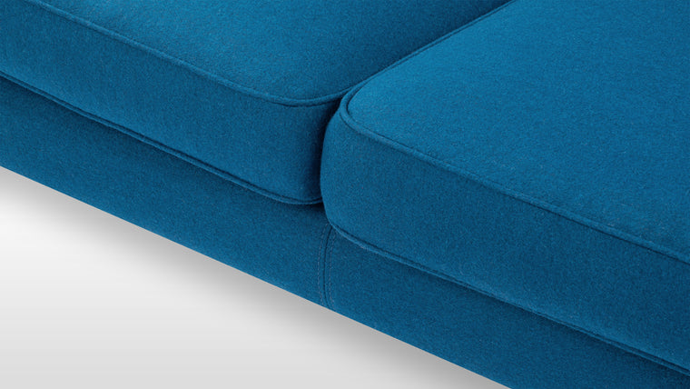 Relax in Style | Offering both beauty and functionality, the Sofa’s plush foam cushion ensures optimal comfort. Its versatile design shines as a statement piece or as part of a cohesive mid-century-inspired setting.
