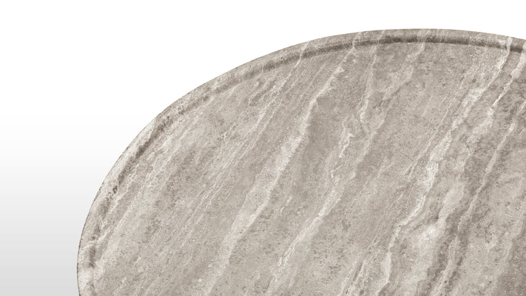 Variation in Veins | The table's travertine surface displays unique, cloud-like veining patterns in warm or cool tones, with a honed finish that exudes understated elegance.
