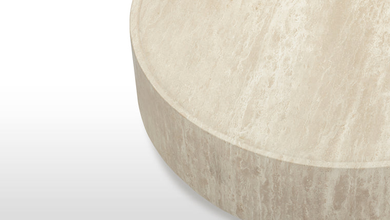 Strong Form | Designed for practicality and style, the Toren Coffee Table’s recessed surface and sturdy pillar design provide a durable and visually appealing centerpiece.
