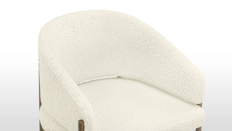 Refined Luxury | Upholstered in sumptuous luxe sherpa, it offers a luxurious tactile experience while ensuring durability and easy maintenance. The soft texture of the luxe sherpa adds an extra layer of opulence, inviting you to indulge in comfort as you dine in style.
