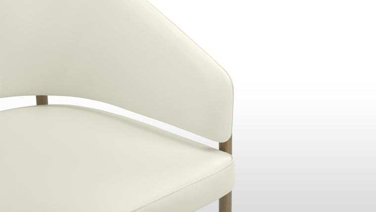 Functional Finesse | The sleek metal legs of the Esme Dining Chair add a touch of vintage charm and sophistication. Their brushed finish complements the richness of the upholstery, creating a harmonious interplay of textures and tones.
