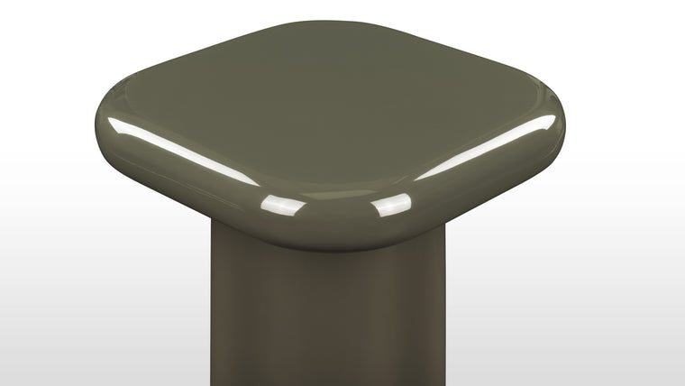 Deep Glossy Color | The table is crafted with a glossy lacquer finish in a rich olive green color. Its sturdy construction includes rounded edges and round column legs.
