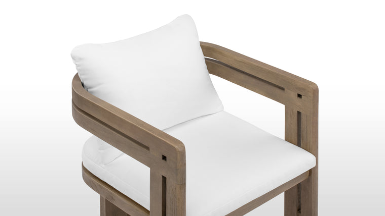 Beautifully Resilient | Enhanced with high-performance outdoor fabric cushions, the Lusso Outdoor Dining Chair ensures luxurious comfort without compromising on durability.
