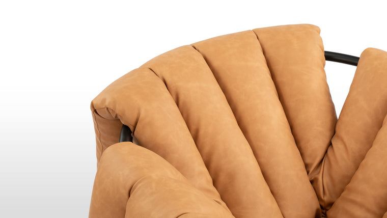 Durable Luxury | Crafted with luxurious vegan leather upholstery in a warm brown tone, the chair features quilted cushioning for deep comfort. The sturdy metal frame and canvas supports ensures durability and longevity.
