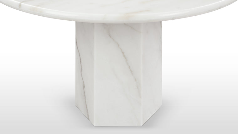 Marble Masterpiece | Made from honed natural marble, this beautiful modern table makes a stunning centrepiece. Its simple, striking form pays homage to this luxurious material, accentuating the distinctive texture and patina.
