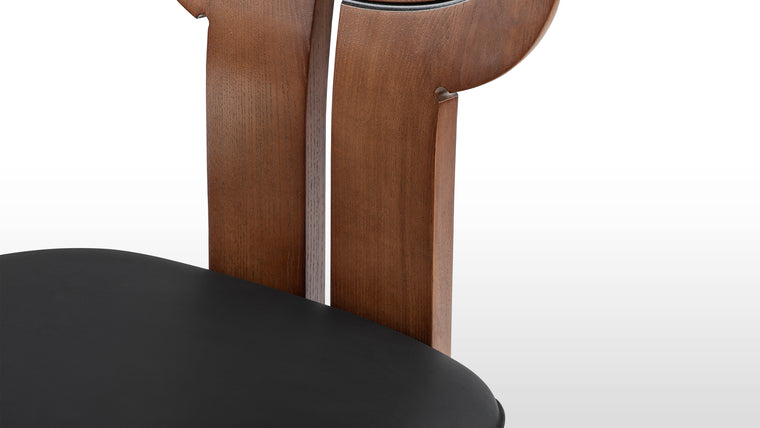 Durable Style | Designed for both style and support, the Africa Chair provides ergonomic seating with its curved seat, sturdy angled legs, and seamlessly integrated backrest. A balance of durability and luxury makes it suitable for daily use.
