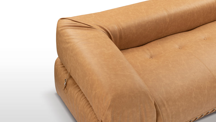 Comfort with an Edge | Crafted from soft matte leather with generous foam padding, the sofa merges refined luxury with rugged, handcrafted details like metal grommets and lace-up accents, giving it an artisanal, industrial edge.
