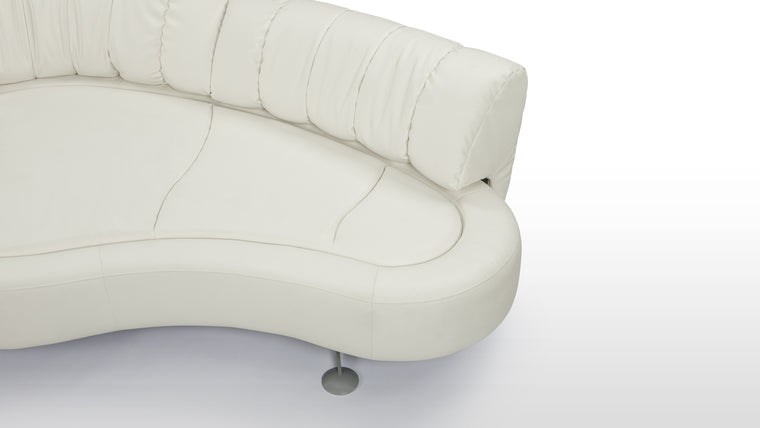 Modern Luxury | Crafted with a solid wood frame and finished with a powder-coated base, this sofa is upholstered in premium off-white leather, adding a touch of elegance to its contemporary form.
