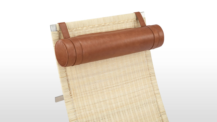 Natural Contrast | Warm woven wicker pairs with cool metallic framing, while the smooth leather headrest adds a final touch of indulgence. Together, these materials create a chair that’s both visually lightweight and texturally rich.
