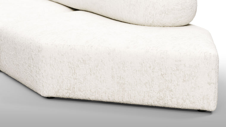 Redefining Relaxation | The cushioning of the sofa provides a unique seating experience that combines softness with support, ensuring that the sofa remains comfortable for extended periods. The sofa’s low profile and generous dimensions encourage a laid-back lounging posture, making it perfect for both casual and formal settings.
