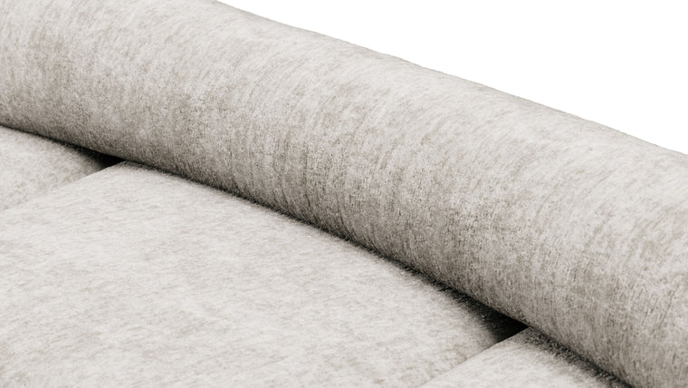 Redefining Relaxation | The cushioning of the sofa provides a unique seating experience that combines softness with support, ensuring that the sofa remains comfortable for extended periods. The sofa’s low profile and generous dimensions encourage a laid-back lounging posture, making it perfect for both casual and formal settings.

