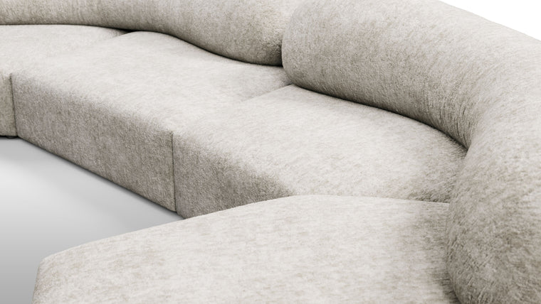 Redefining Relaxation | The cushioning of the sofa provides a unique seating experience that combines softness with support, ensuring that the sofa remains comfortable for extended periods. The sofa’s low profile and generous dimensions encourage a laid-back lounging posture, making it perfect for both casual and formal settings.
