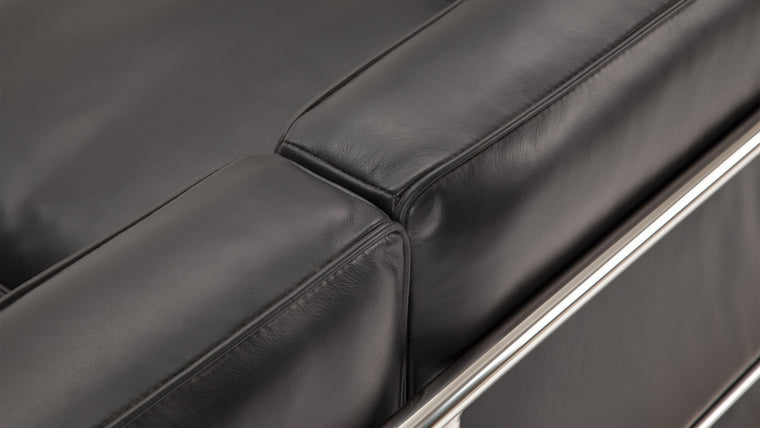 Sleek Frame | The iconic tubular frame design is instantly recognizable and adds a touch of architectural elegance to your space. It not only provides exceptional stability, but also complements the leather upholstery with its polished, minimalist aesthetic. 
