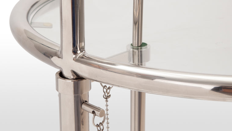 Modern marvel|Its tubular steel frame and glass top, along with its sleek and streamlined appearance, reflects the influence of the modernist movement's emphasis on industrial materials and efficiency.
