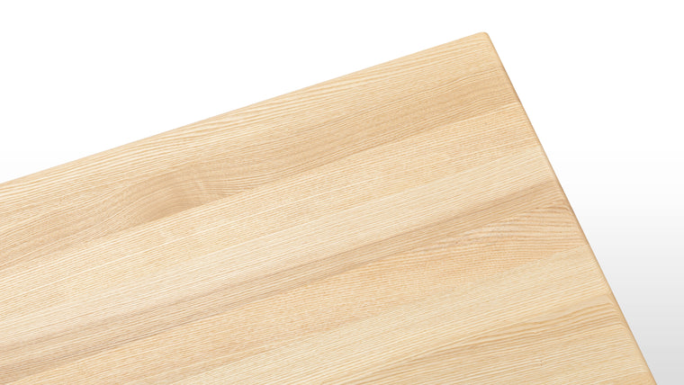 Made to Last | Combining expert craftsmanship and quality materials, this dining table promises longevity. It’s made of solid ash for durability and boasts tapered legs connected by cross stretchers for added stability at its base. 
