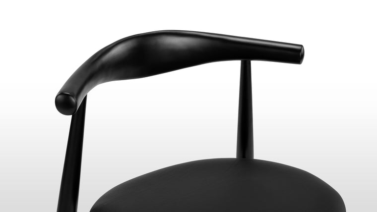 IN THE ROUND | The rounded backrest of this chair is masterfully steam-bent from a single piece of wood, giving you plenty of back support. 
