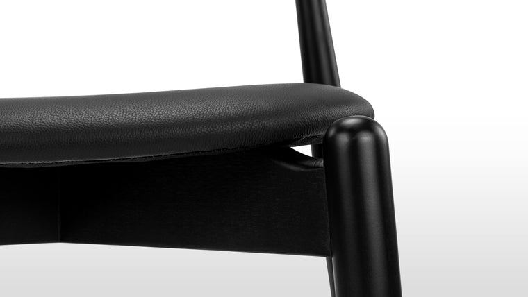 PERFECTLY PRACTICAL | Courtesy of its minimalist silhouette and smart design, the Elbow Chair is lightweight and stackable. Change up your dining and office space effortlessly with this chic seat.
