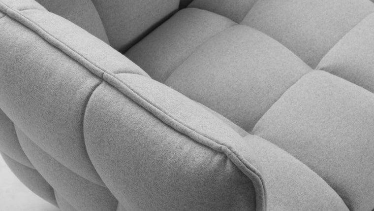 COMFORT AND QUALITY | At once elegant and casual, the generous volume and down feather cushions embrace and provide maximum comfort. Husk is not a thing to sit on, but rather a space to sit in. 
